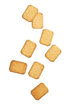 Cracker cookies falling isolated on white background with clipping path Stock Photos