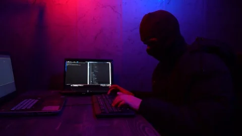 Cracker in a mask will break the computer. Theft of digital data Stock Footage 124360779