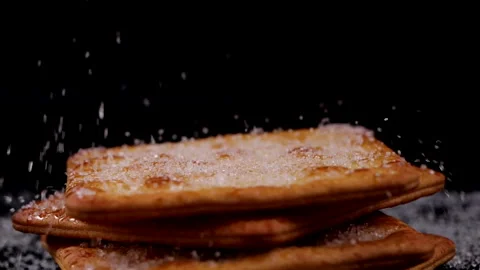 Cracker with sugar falling in slow motion Stock Footage 133174208