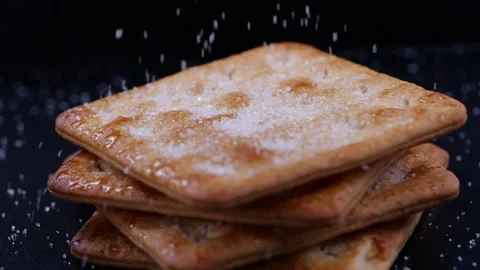 Cracker with sugar falling in slow motion Stock Footage 133975472