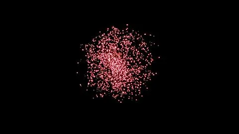 Crackers busting in dark sky creating red sparkles 스톡 사진