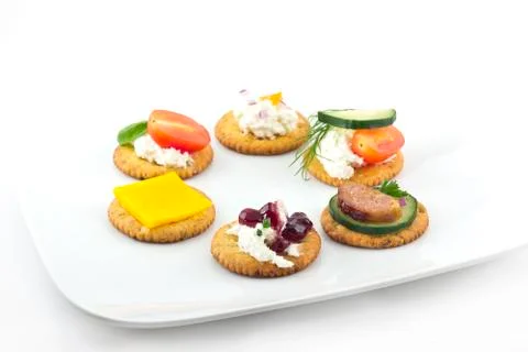 Crackers canopes with toppings Фото