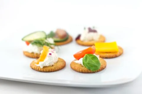 Crackers canopes with toppings Stock Photos
