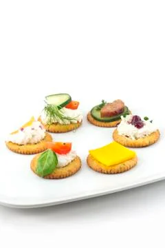 Crackers canopes with toppings Stock Photos
