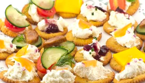 Crackers canopes with toppings Stock Photos
