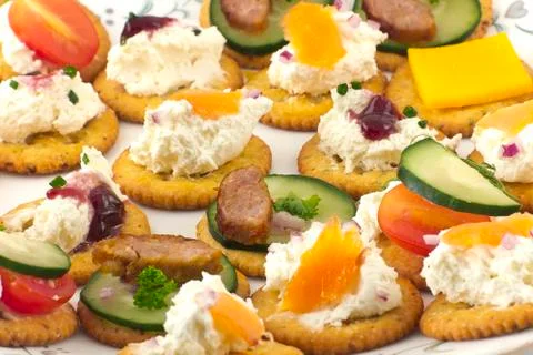 Crackers canopes with toppings Stock Photos