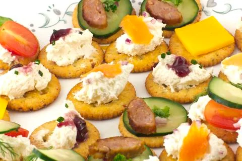 Crackers canopes with toppings Stock Photos