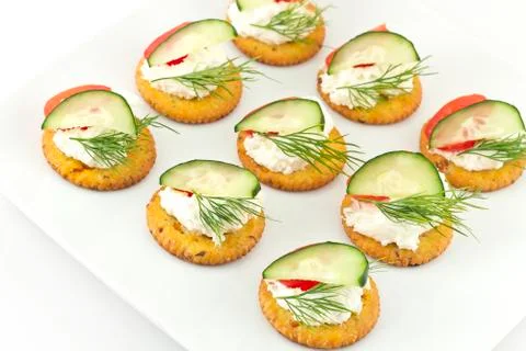 Crackers with cheese tomato cucumber and dill Stock Photos