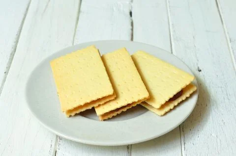 Crackers crispy cheese stuffed with pineapple on wood-table. Stock Photos
