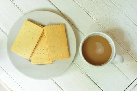 Crackers crispy cheese stuffed with pineapple and coffee on wood-table. Stock Photos
