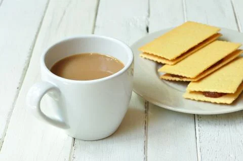 Crackers crispy cheese stuffed with pineapple and coffee on wood-table. Stock Photos