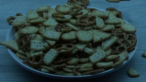 Crackers fall on the white plate 스톡 동영상 79915326