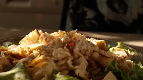 Crackers falling on cezar salad slowmotion Stock Footage 155080222