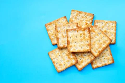 Crackers with sugar on blue background. Stock Photos