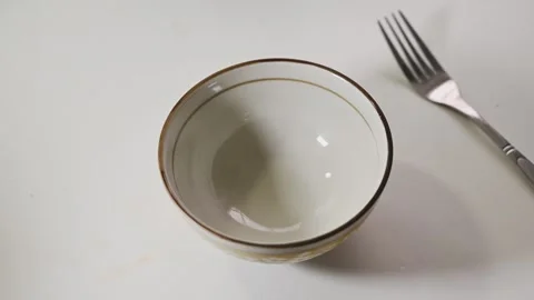 Cracking and Beating an Egg in a Bowl Before Cooking Stock Footage 345341210