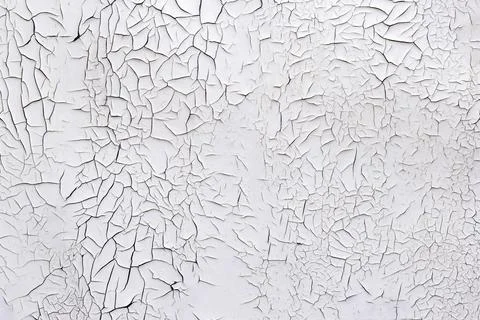 Cracking and peeling paint on a wall White Foto stock