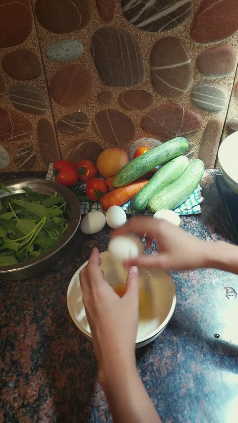 Cracking a chicken egg open into a bowl Stock Footage 276204166