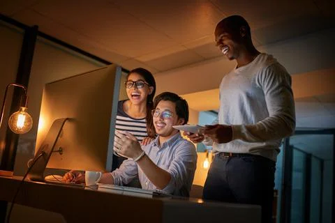 Cracking codes is what makes them happy. Shot of computer programmers working Stock Photos