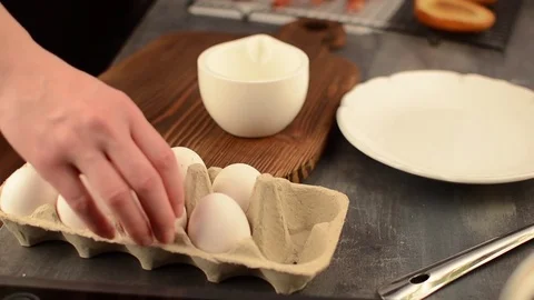 Cracking egg and whisk Stock Footage 76373084