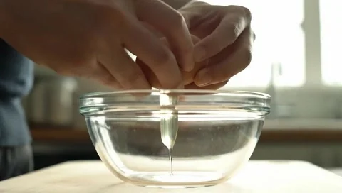 Cracking Egg Into Bowl Close Up Stock Footage 310142922