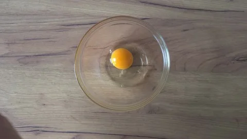 Cracking Egg Into Bowl Video stock 220350208