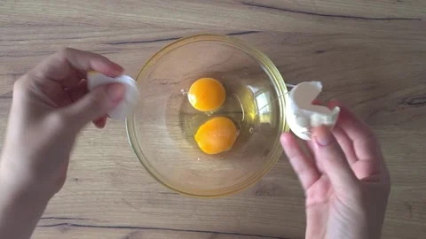 Cracking Egg Into Bowl Stock Footage 220350225