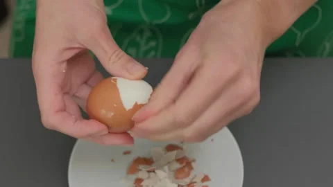 Cracking Egg into Bowl with Nuts Cooking Close-Up Stock Footage 341420334