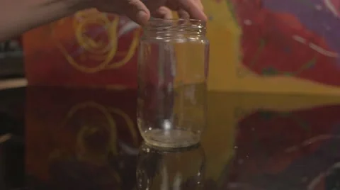 Cracking an egg in a container Video stock 62640186