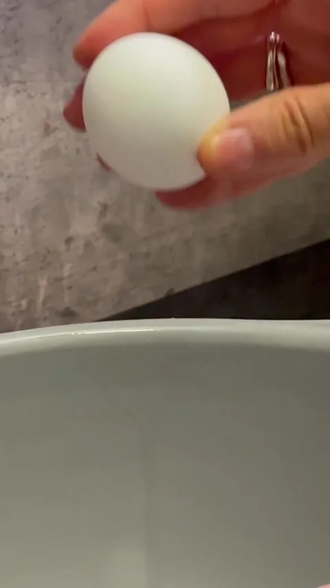 Cracking an egg to make cookies Stock Footage 303823163