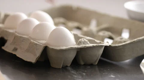 Cracking egg into mixing bowl Stock Footage 66777926