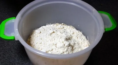 Cracking an egg into pancake batter. Filmed in 4k UHD. Stock Footage 53975220