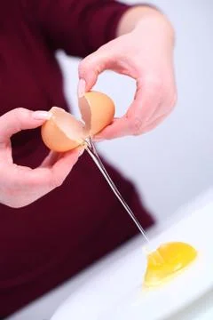 Cracking an egg Stock Photos