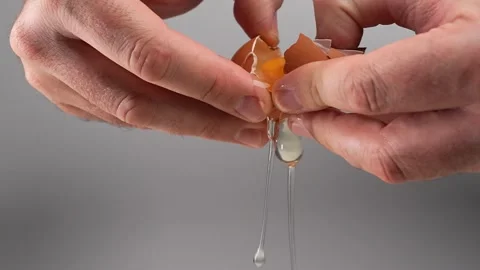 Cracking Egg in slow motion Stock Footage 249924607