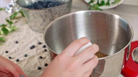 Cracking eggs and pouring sugar, making dough. Video stock 68016962