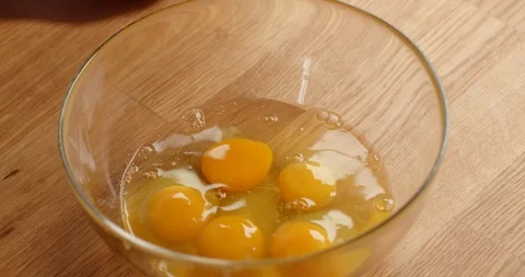 Cracking eggs in bowl, close up of making dough Video stock 126258366