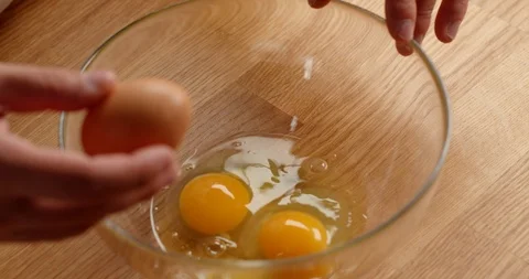 Cracking eggs in bowl, close up of making dough 스톡 동영상 126258381