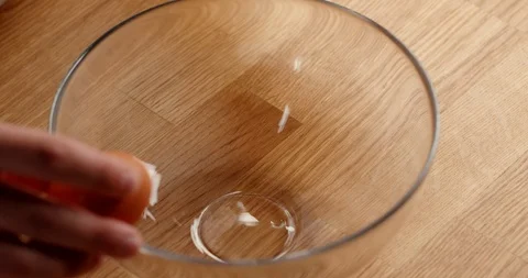 Cracking eggs in bowl, close up of making dough Видео 126258580