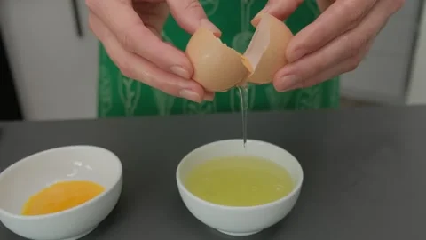 Cracking Eggs in a Bowl Cooking Kitchen Close-Up Stock Footage 341423070