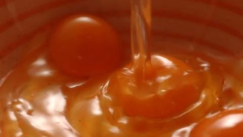 Cracking Eggs into Bowl, Cooking Process. Stock Photos