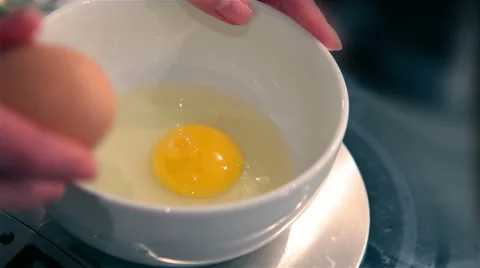 Cracking eggs Stock Footage 41404786