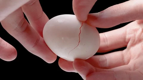 Cracking eggs, low angle 4K slow motion video. Stock Footage 256582095