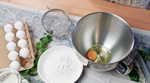 Cracking eggs, making dough Stock Footage 68163933