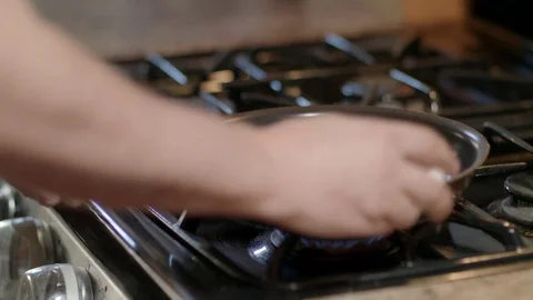 Cracking eggs in pan Stock-Footage 81252767