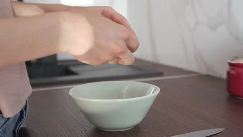 Cracking a farm fresh egg by a knife Stock Footage 146801751