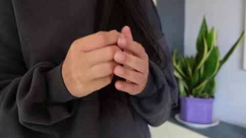 Cracking fingers with hand, close-up simple lifestyle scene Stock Footage 320423030