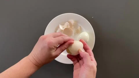 Cracking fresh eggs for meal prep Stock-Footage 343864286