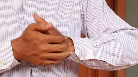 Cracking his finger knuckles or joints for a sense of relief Video stock 345702905