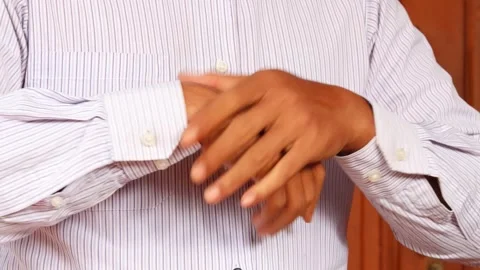 Cracking his finger knuckles or joints for a sense of relief 스톡 동영상 345702909