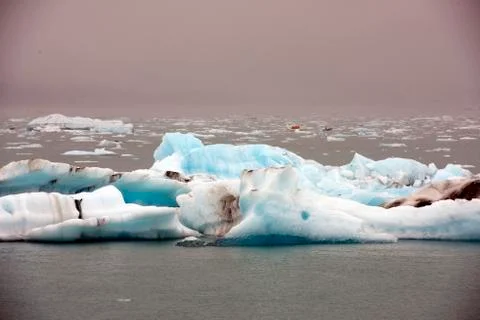 Cracking ice floating on lake Stock Photos