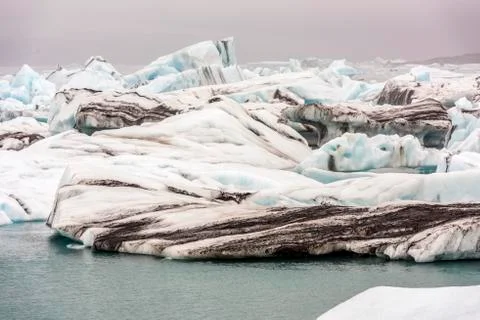 Cracking ice floating on lake Stock Photos